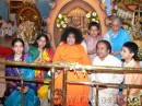 13. Swami poses for a photograph with the entire family